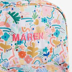 A floral backpack that's extra comfy and ready to handle daily adventures. Patterned with a colorful collection of garden friends that flit and flutter over the white exterior, the kids' large knapsack is constructed of supremely durable polyester made from recycled water bottles. A roomy interior holds everything your kid needs-books, school supplies, extra layers-and there's a padded pocket to keep their tablet protected. Outside pockets hold snacks, water bottles and more. Pair this book bag