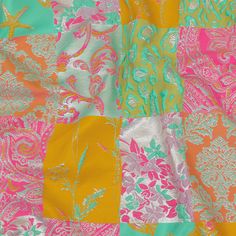 an orange, pink and green patchwork quilt