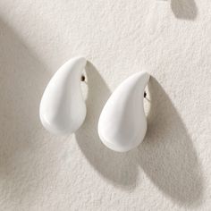 - Enamel with Stainless Steel Base -Hypoallergenic -Lightweight, hollow design for a comfortable experience. A must have statement earrings! Trendy White Drop Clip-on Earrings, Modern White Clip-on Earrings, Modern White Clip-on Earrings For Gift, White Modern Drop Earrings, Minimalist White Teardrop Earrings, Modern White Drop Earrings, White Hypoallergenic Drop Clip-on Earrings, White Hypoallergenic Clip-on Drop Earrings, Hypoallergenic White Drop Clip-on Earrings