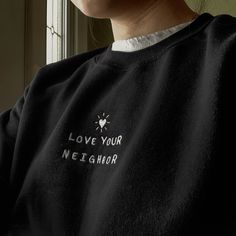 "*SIZES ARE UNISEX* -For women, I'd suggest your usual size for a regular fit (size up for a more relaxed fit). Men should size up for a more relaxed fit. *these sweatshirts are extra comfy when oversized 💛🏠 \"Love Your Neighbor\" embroidered on a comfy crewneck. The perfect Christian sweatshirt. A sturdy and warm sweatshirt bound to keep you warm in the colder months. A pre-shrunk, classic fit sweater that's made with air-jet spun yarn for a soft feel and reduced pilling. Your new favorite sw Embroidered Long Sleeve Sweatshirt, Winter Tops With Embroidered Logo For Everyday, Black Embroidered Text Sweater For Fall, Winter Top With Embroidered Text For Everyday, Black Sweater With Embroidered Text For Fall, Everyday Long Sleeve Tops With Embroidered Logo, Long Sleeve Tops With Embroidered Logo For Everyday, Long Sleeve Tops With Embroidered Logo, Everyday Sweatshirt With Embroidered Logo And Crew Neck