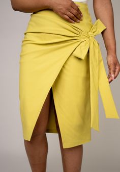 Meet the skirt that effortlessly transitions from day to night. Our versatile wrap skirt is designed for the modern woman who loves to mix and match her wardrobe. Whether you pair it with heels for a sophisticated look or with flats or sneakers for a casual vibe, this skirt is sure to become a staple in your collection. The endless styling possibilities make it a must-have piece for every fashion-forward woman. SIZE & FIT: High Waist: Flattering high waist design for a sleek silhouette. Side Det Summer Workwear Skirt With Tie Waist, Summer Wrap Skirt With Tie Waist For Work, Chic Summer Wrap Skirt For Work, Chic Knee-length Wrap Skirt For Day Out, Spring Workwear Wrap Skirt With Tie Waist, Spring Wrap Skirt With Tie Waist For Work, Knee-length Wrap Skirt For Spring Workwear, Chic Green Spring Wrap Skirt, Chic Green Wrap Skirt For Spring