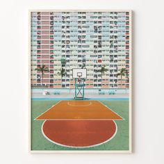 a basketball court in front of an apartment building with palm trees on the other side