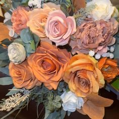 a bouquet of flowers sitting on top of a table