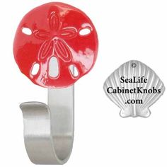 an image of a blue sand dollar on a metal hook with the sealife cabinet knobs com logo below it