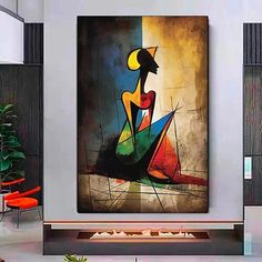 an abstract painting hangs on the wall in a modern living room