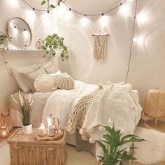 a bedroom with white walls and lights on the ceiling