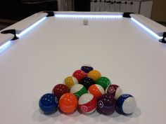 a pool table with several different colored balls