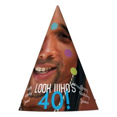 a man wearing a party hat with the words look who's 40 on it