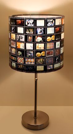 a lamp that has pictures on it and is turned on to look like film strips