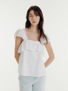 This is a casual and trendy top by CLAIR DE SAGE that is made out of high quality and sturdy material. With distinctive mood of the design and comfortable wear, you can style it for your casual daily outfit.- Light fabric suitable for summer season- Short puffy sleeves with ruffles- Trendy and feminine mood Trendy Summer Short Sleeve Top With Ruffles, Spring Cotton Ruffle Short Sleeve Top, Summer Ruffle Top With Relaxed Fit, Chic Cotton Short Sleeve Top For Spring, Relaxed Fit Ruffled Blouse For Day Out, Relaxed Fit Ruffled Tops For Vacation, Summer Ruffled Relaxed Fit Top, Relaxed Fit Ruffle Top For Summer, Relaxed Fit Ruffled Top For Summer