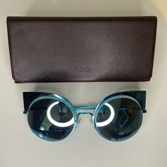 Great Condition, Minor Scratches On The Left Temple, Please See Pics Color: Torquoise/Blue (W5i/T7) Gender: Women Shape: Cat Eye Material: Metal Lens: Nylon Lens Type: Mirrored Lenses Size: 53/22/135 Rxable: No Frame Colour: Blue Lens Colour: Blue Designer Sunglasses For Summer Evenings, Luxury Blue Sunglasses For Summer, Blue Sunglasses For Summer Evening, Designer Blue Sunglasses For Formal Occasions, Lens Colour, Fendi Accessories, Fendi Sunglasses, Blue Lens, Blue Lenses