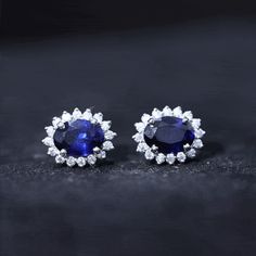 Product Details Captivate your style with these Classic Stud Earrings that feature a 5X7 MM Oval Created Blue Sapphire set in Prong Setting encircled with Moissanite Halo. Product Information SKU SHP-EARRINGS042014293 Length 10.3 mm Width 8.3 mm Weight 1.52 gm (Approximate) LAB CREATED BLUE SAPPHIRE INFORMATION No.of Stones 2 Pieces Total Weight 2.00 Carat (Approximate) Dimension(approx) Oval-5X7 mm-2 Pcs Color Blue Cut Brilliant Shape Oval Setting Type Prong-Setting Quality Grade AAAA MOISSANIT Gia Certified Sapphire Earrings For Formal Occasions, Gia Certified Sapphire Diamond Earrings For Formal Occasions, Formal Gia Certified Sapphire Diamond Earrings, Elegant Blue Gia Certified Diamond Earrings, Formal Round Sapphire Diamond Earrings, Blue Halo Setting Earrings For Formal Occasions, Blue Halo Setting Earrings For Formal Events, Formal Blue Halo Setting Earrings, Formal Oval Sapphire Diamond Earrings