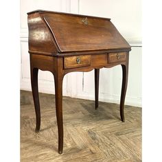 an old wooden desk with two drawers on the top and one drawer at the bottom