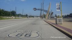 the route 66 sign is painted on the road