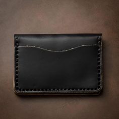 A Leather Wallet that goes Above and Beyond Your Expectations.When you hold this wallet you will love the supple and comfortable feel. Unlike most department store wallets, our leather features premium Horween leather, thick hand-stitching, and polished edges. Every inch of our craftsmanship has a high level of attention to detail. We build wallets to last a lifetime - and guarantee it.Our full-grain Horween leather means your wallet will develop character and patina. We hand-sew this wallet wit Horween Chromexcel, Horween Leather, Personalized Keychain, Black Hand, Above And Beyond, Leather Design, Department Store, Custom Engraving, Full Grain Leather