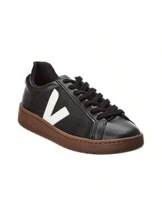 Introducing the VEJA Urca Sneaker, the must-have footwear for the environmentally conscious fashionista. Make a style statement while supporting a brand that's making a difference in the world. These black and white faux leather sneakers feature logo accents, a lace-up closure, and a lightly padded insole for all-day comfort. The rubber sole provides traction for any urban adventure. Imported and available in European sizes, be sure to reference the size chart for US conversions. Step out in sty Modern Lace-up Sneakers For Fall, Logo Sneakers For Spring Streetwear, Spring Streetwear Sneakers With Logo, High-top Sneakers With Logo For Spring, Spring High-top Sneakers With Logo, Spring Leather Sneakers With Logo, Spring Low-top Sneakers With Logo, Spring Logo Lace-up Sneakers, Spring Lace-up Sneakers With Logo