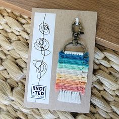 a keychain that is made out of yarn and has a hook on it