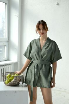 "Moos green linen short-sleeve kimono jacket and shorts. Height of my model - 170 cm. / size - S Choose size: XS Bust 82 - 84 cm. ( 32 1/4\" - 33\") Waist 66 - 68 cm. / (26\" - 26 3/4\") Hips 90 - 92 cm. / (35 1/2\" - 36 1/4\") S Bust 86 - 88 cm. ( 33 3/4\" - 34 3/4\") Waist 70 - 72 cm. / (27 3/4\" - 28 1/4\") Hips 94 - 96 cm. / (37\" - 37 3/4\") M Bust 90 - 92 cm. ( 35 1/2\" - 36 1/4\") Waist 74 - 76cm. / (29 1/4\" - 30\") Hips 98 - 100 cm. / (38 1/2\" - 39 1/4\") L Bust 94 - 96 cm. ( 37\" - 37 Green Kimono Sleeve Sets For Spring, Spring Green Sets With Kimono Sleeves, Green Sets With Kimono Sleeves For Spring, Green Linen Casual Sets, Casual Green Linen Set, Green Linen Relaxed Fit Sets, Green Relaxed Fit Linen Sets, Casual Linen Kimono For Loungewear, Summer Cotton Sets With Kimono Sleeves