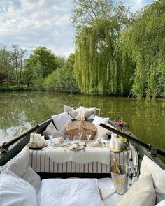 a boat filled with lots of pillows and food on top of it's side