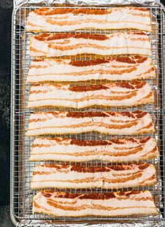 hotdogs are cooling on a wire rack in the oven, ready to be cooked