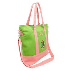 a green and pink tote bag on a white background