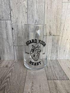 a glass with the words guard your heart on it