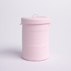 a pink and white basket on a white background