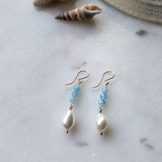 The light aqua blue color of these Peruvian Amazonite and Freshwater Pearl drop dangle earrings is absolutely dreamy! The gorgeous aqua blue Peruvian Amazonite stones pair beautifully with organically shaped freshwater pearls to give you that tropical/coastal vibe. Both the Peruvian Amazonite and Freshwater Pearls are superior AAA grade (the best you can get!) That is why the Peruvian Amazonite has that dreamy deep blue color, and the pearls have the most captivating iridescence to them. If you Aqua Blue Color, Amazonite Stone, Light Aqua, Drop Dangle Earrings, Pearl Drop, Aqua Blue, Earring Necklace, Deep Blue, Fresh Water