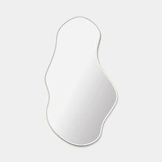 a white mirror with an oval shape on it