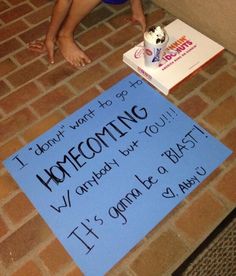 a child sitting on the floor next to a sign that says, i don't want