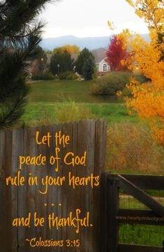 a wooden fence with a bible verse written on it