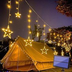 a tent with lights hanging from it's sides