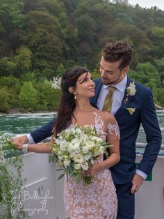 a bride and groom standing next to each other