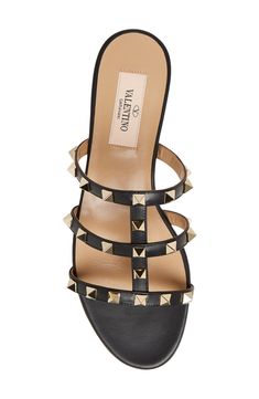 Signature pyramid studs flash along the straps of this Italian-calfskin sandal designed to pair perfectly with both casual and more polished looks. Leather upper, lining and sole Made in Italy Women's Designer Shoes Designer Evening Sandals With Spikes, Designer Calf Leather Sandals With Studded Outsoles, Designer Flat Sandals With Studded Rubber Outsoles, Designer Flat Sandals With Studded Outsoles, Luxury Sandals With Spikes And Round Toe, Luxury Spiked Round Toe Sandals, Leather Sandals With Studs And Open Heel, Leather Sandals With Spikes And Round Toe, Leather Sandals With Spikes And Open Heel