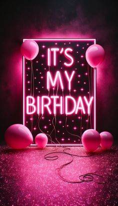 it's my birthday neon sign with balloons and streamers in the dark background