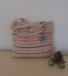 This hand-knitted colorful striped bag is meticulously crafted from high-quality macrame yarn. With dimensions of 38x32 cm, its spacious design is perfect for everyday use, whether at the beach, market, or for a chic evening out. This Boho Chic large tote bag comfortably fits over the shoulder and offers ample space to securely carry all your essentials. Whether you're treating yourself or looking for a special gift, this bag is the perfect choice. Thank you for visiting Multicolor Rectangular Yarn Bag, Multicolor Crochet Bag For Everyday Use, Multicolor Yarn Bag For Everyday Use, Multicolor Yarn Tote Bag, Multicolor Yarn Bag For Daily Use, Multicolor Yarn Crochet Bag For Everyday Use, Multicolor Crochet Yarn Bag For Everyday Use, Multicolor Hand Knitted Everyday Bag, Everyday Multicolor Hand Knitted Bag