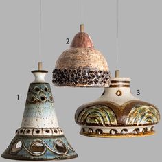 three different types of hanging lights with numbers on the top one is white, blue and green