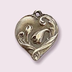 This is a very romantic vintage inspired heart pendant.  I have a love for vintage things (especially jewelry), so when I saw several molds made from vintage heart pendants, I had to have them.   This works great as a pendant on a chain or as a charm on a bracelet. Since this item is made to order, please allow 2 weeks for it to be created and shipped out to you.  If you need this quicker, please convo me!  Initials can be placed on the back of the pendant.  Since this is handcrafted, no two wil Vintage Double Heart Engraved Necklace, Elegant Vintage Heart Pendant Jewelry, Vintage Engraved Double Heart Necklace, Vintage Antique Silver Flower Pendant Jewelry, Vintage Heart Cut Jewelry For Valentine's Day, Antique Heart Necklace For Valentine's Day, Vintage Engraved Heart Cut Jewelry, Vintage Engraved Heart Necklace For Wedding, Vintage Sterling Silver Heart Necklace Nickel Free