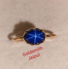 Band : Goldsmith jaipur  Material : 14k Yellow Gold Gemstone : blue  Lindy star sapphire Sapphire Stone size : 8x 6mm Stone Wight : 2.10Ct Stone Shape :Oval Stone Color : Blue Band Color : Yellow   style: Minimalist Ring Size : All Size Available All of our jewelry is handmade with great care by our team. Thank you for visiting our store. https://www.etsy.com/your/shops/Goldsmithjaipur/tools/listings/stats:true/1356025660 Celestial Yellow Gold Sapphire Ring, Vintage Star Sapphire Ring, Celestial Star-shaped Sapphire Ring, Lindy Star Ring Sapphire, Celestial Star-shaped Sapphire Gemstone Ring, Star-shaped Sapphire Gemstone Rings, Star Sapphire Cabochon Ring, Star Sapphire Gemstone, Blue Star Sapphire Ring