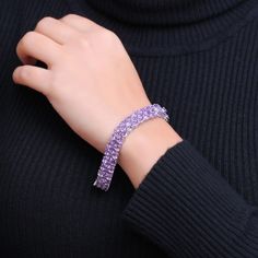 Turn heads with the vibrant color and attention-getting look of this oval-shaped purple amethyst triple-row line bracelet in silver. Fashioned in sterling silver Sideways 5.0 x 3.0mm oval-shaped bright purple amethyst shine along the brick-patterned triple-row design. This 7.5-inch bracelet secures with a box clasp. Purple Fine Jewelry Bracelet, Purple Jubilee Tennis Bracelet, Bracelet In Silver, Silver Jewelry Design, Box Clasp, Bright Purple, Purple Amethyst, Sterling Silver Bracelets, A Box