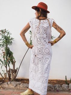 Super cute long white crochet dress with lots of detailed hand work. We hand source antique and vinatage crochet & lace textiles and up-cycle it here in Ibiza in to unique on off a kind garment just for you. Due to the nature there could be some imperfections but we do our best to only recycle mint condition textiles. Size is small-medium Condition is perfect Sleeveless Lace Beach Dress, Bohemian Beach Cover-up Dress With Crochet Trim, White Crochet Maxi Dress For Beach, White Crochet Maxi Dress For The Beach, Sleeveless Crochet Lace Dress For Festival, Summer Lace Work Maxi Dress, White Crochet Trim Beachwear Dress, White Lace Crochet Top For Beachwear, White Bohemian Crochet Top With Lace Trim