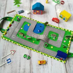 a play mat with cars and trucks on it