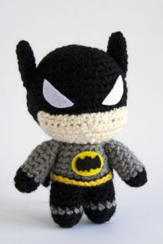 a crocheted batman stuffed animal on a white background