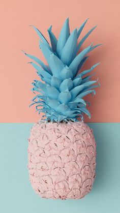 a pink and blue pineapple sitting on top of a table