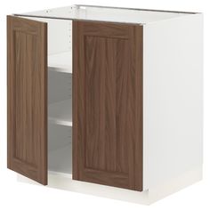 a white and brown cabinet with two doors on each side, one door open to reveal the other