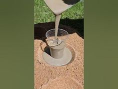 a pitcher pouring water into a cup