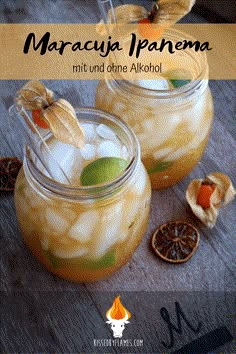 two mason jars filled with liquid and fruit