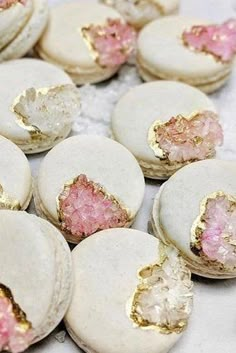 some white and pink cookies with gold flecks