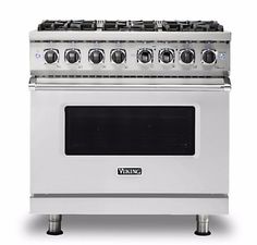 a white stove with four burners and two oven doors on each side, in front of a white background