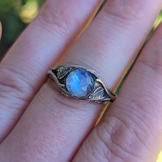 "\"Moonstone Leaf\" sterling silver ring. This ring was inspired by the way vines invade a forest and grow from every branch becoming a beautiful collage of foliage and embracing the trees and landscape around them. The vines on the ring flow around around the ring and over the Moonstone to create a beautiful scene or the tranquil embrace of the leaves. The ring features a 8mm Moonstone in a Solid Sterling silver mounting and will make the perfect artistic accent to show off your personal style. Nature-inspired Moonstone Ring, Elven Ring, Vines Leaves, Digital Sculpting, Ring Moonstone, Beautiful Collage, Nature Ring, Wax Casting, Lost Wax Casting